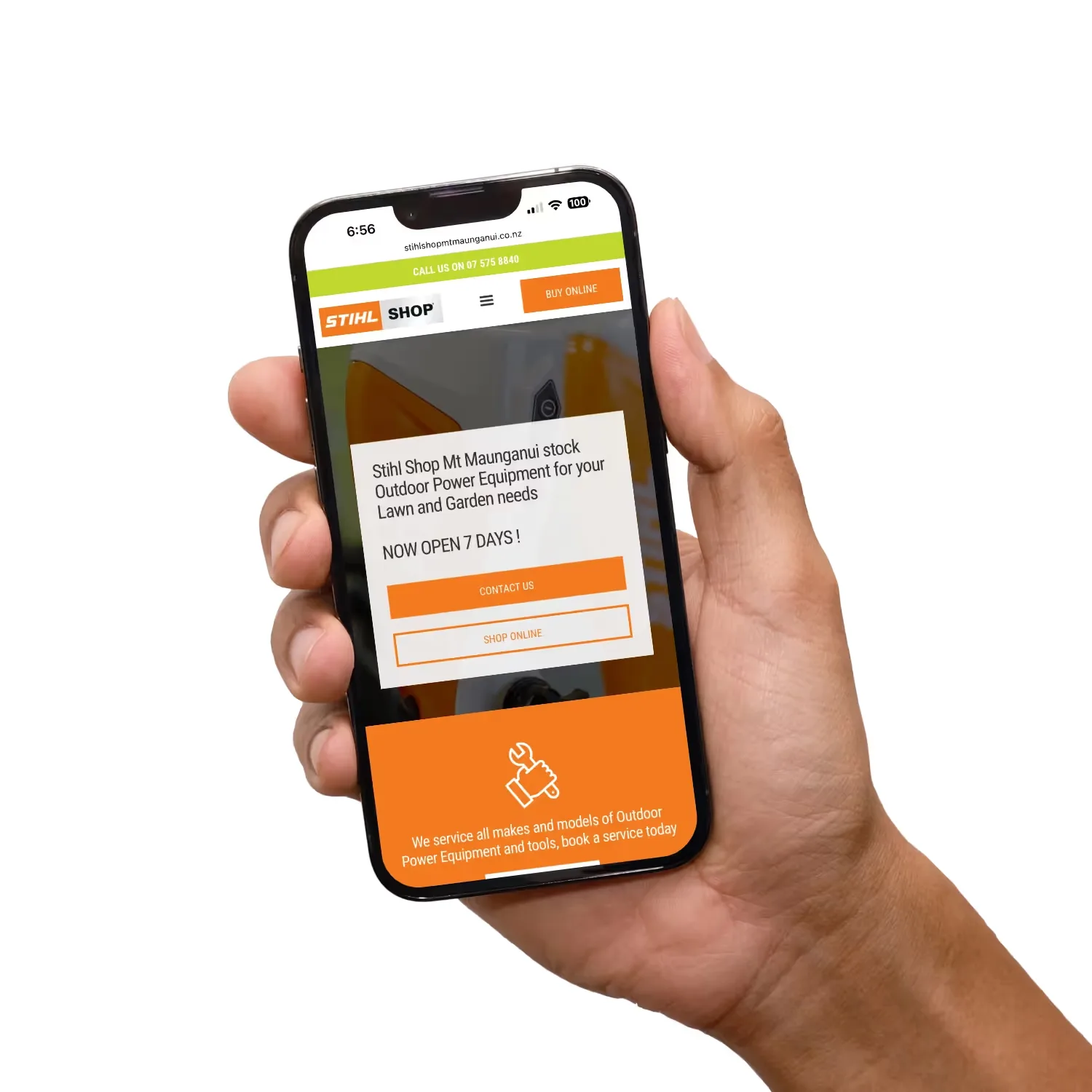 Hand holding mobile phone with still website.