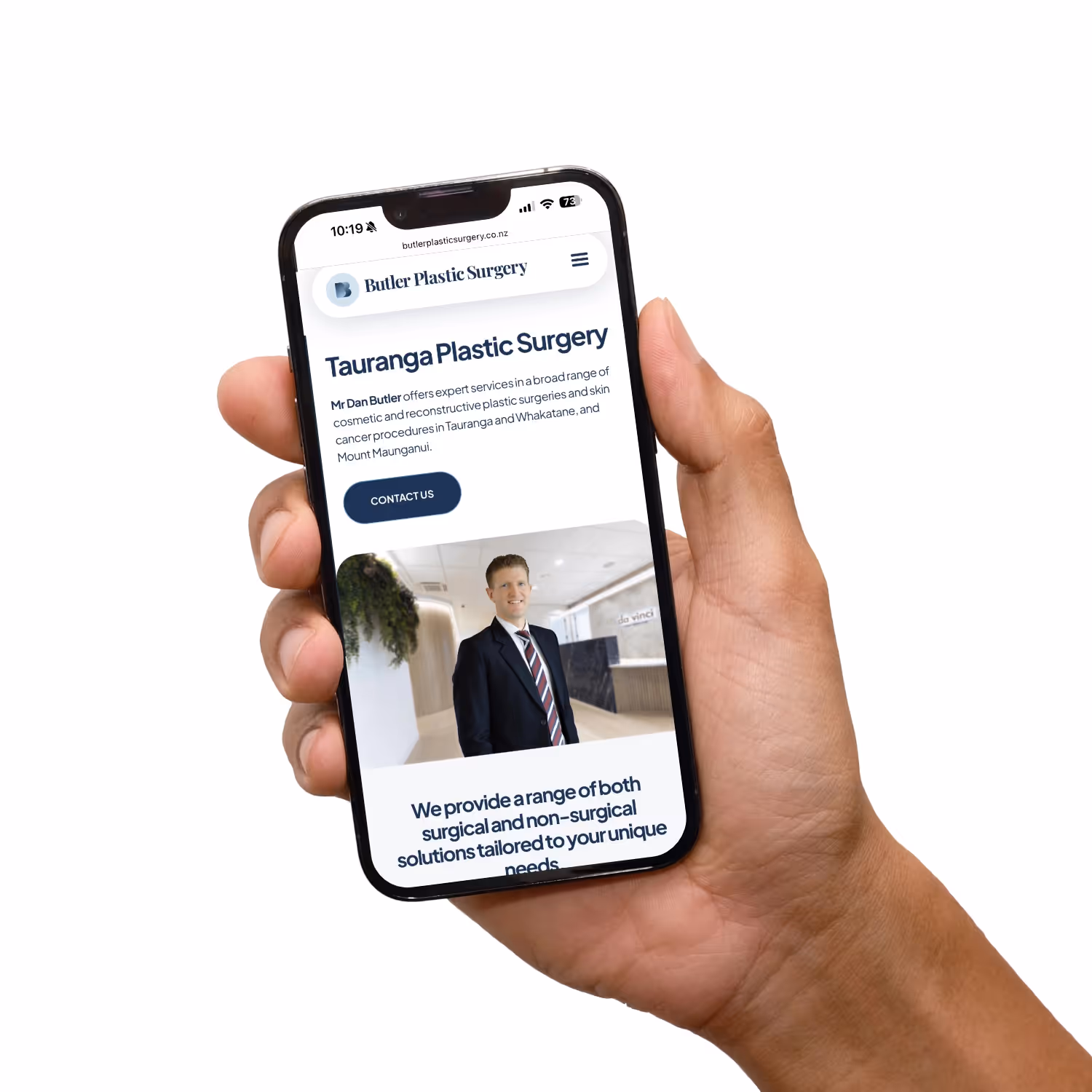 Hand holding mobile with website.
